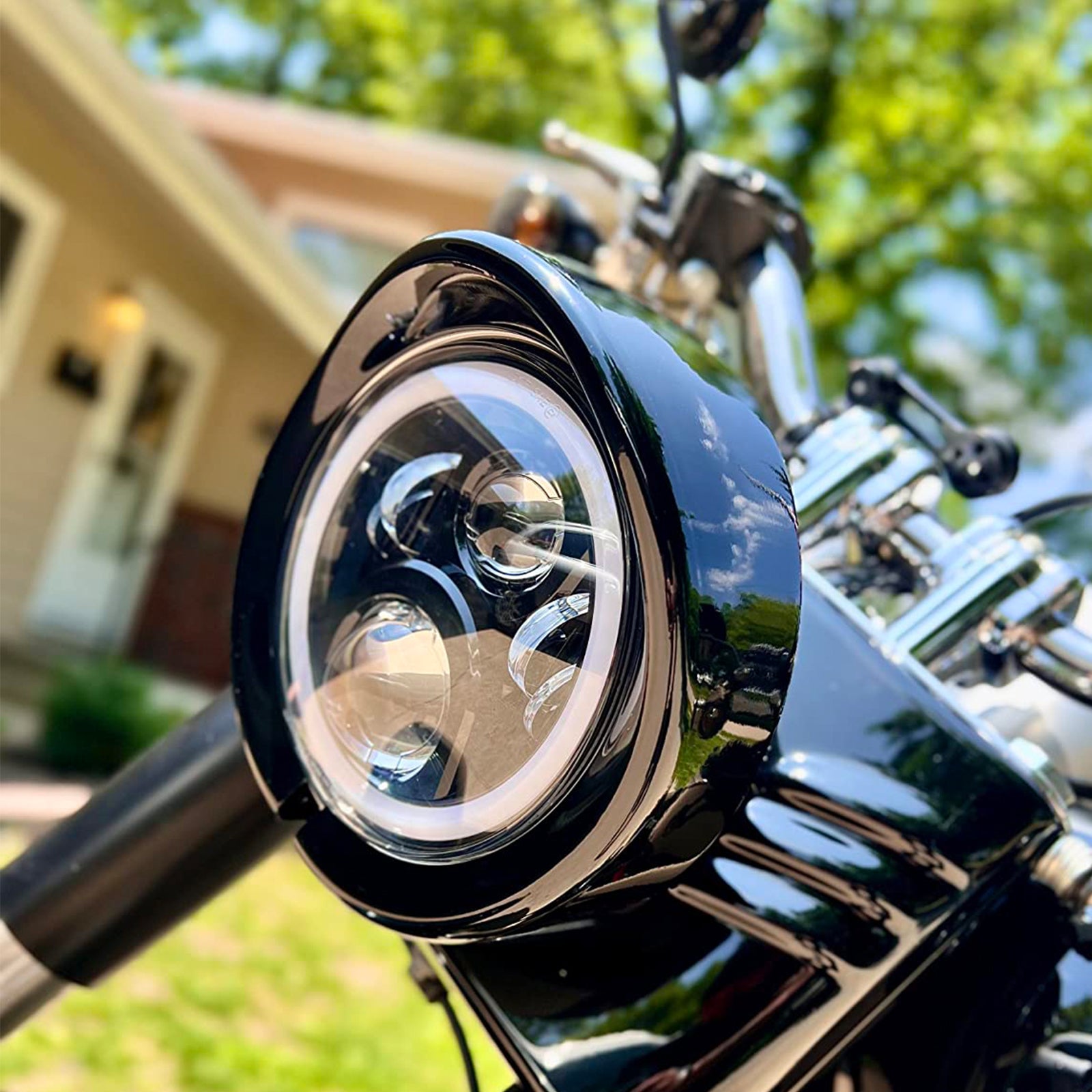 Premium 5.75" Visor-Style Headlight Trim Ring for Harley-Davidson on a motorcycle.